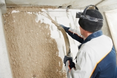 13111012 - plasterer at stucco work with liquid plaster